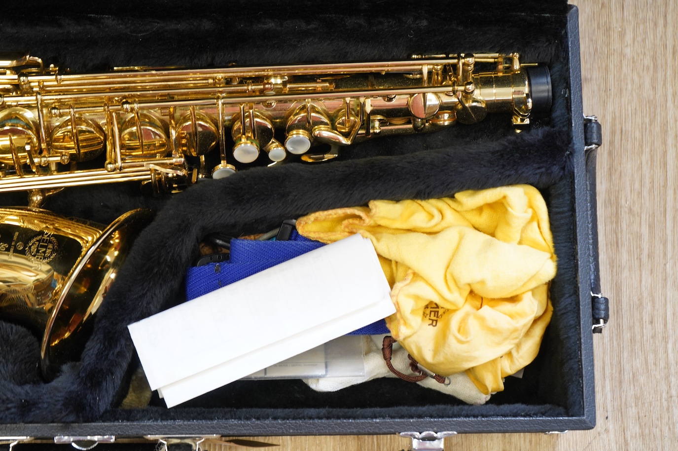 A cased Selmer 80 Super Action Series II brass alto saxophone. Condition - good